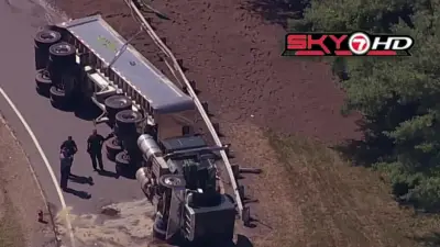 Tractor trailer rolls over in Lexington