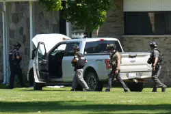 Police say a man opened fire outside a church before staff fatally shot him